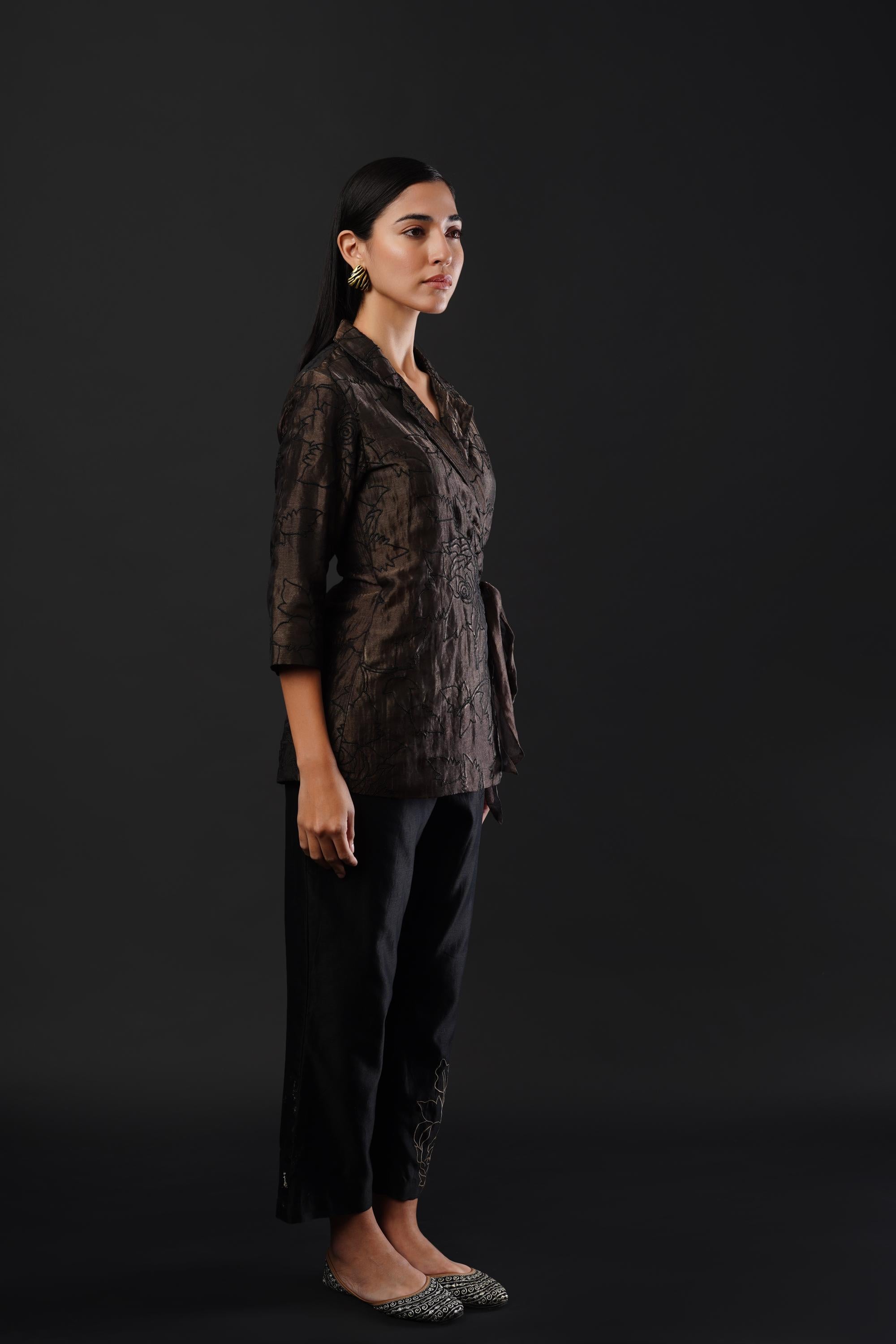 Embroided co-ordinated set featuring a coat paired with trousers.