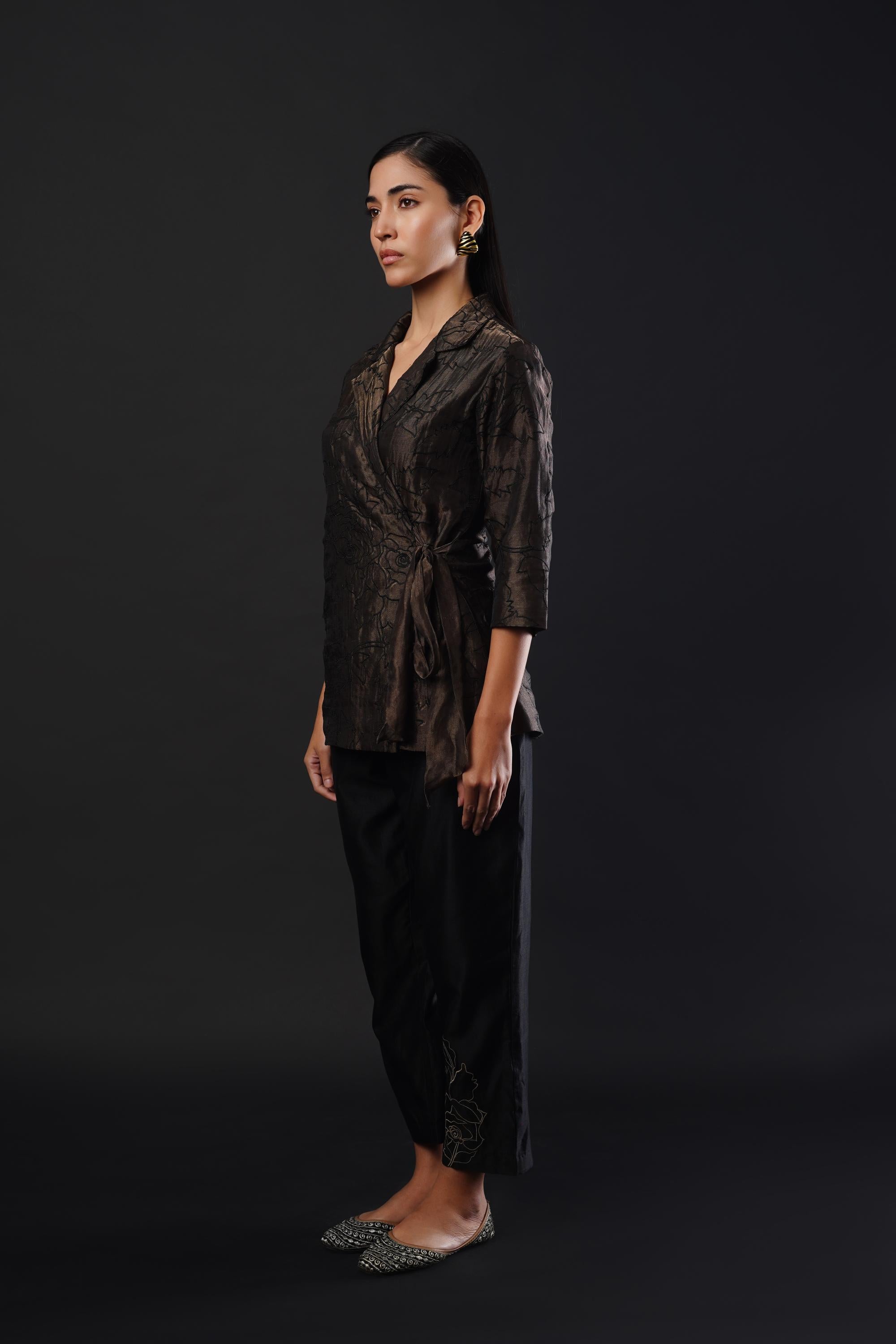 Embroided co-ordinated set featuring a coat paired with trousers.