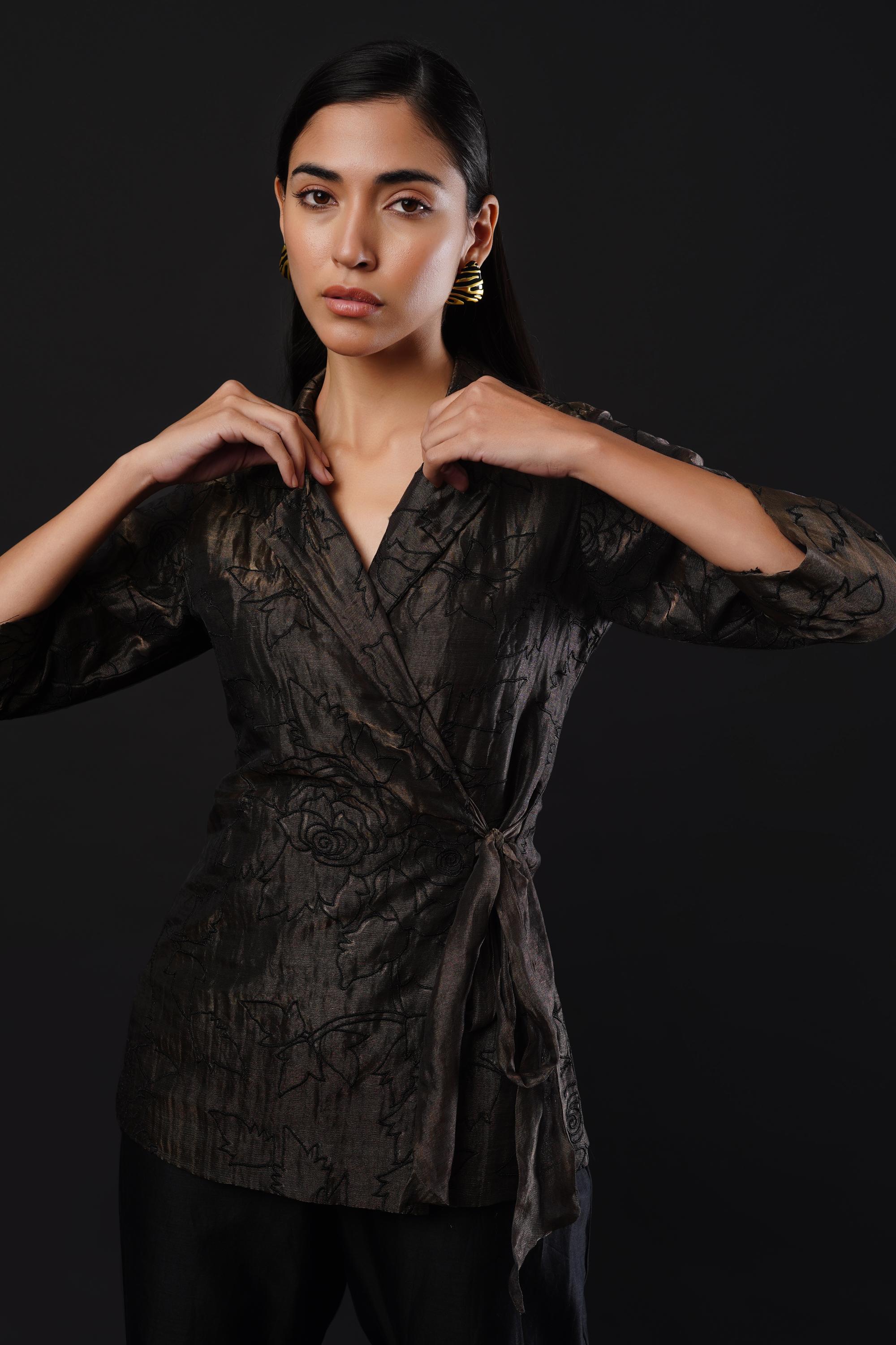 Embroided co-ordinated set featuring a coat paired with trousers.